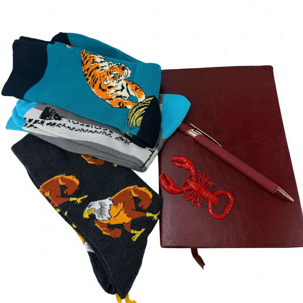 Men's gift bundle featuring colorful animal socks, leather-style notebook, and red lobster bottle opener