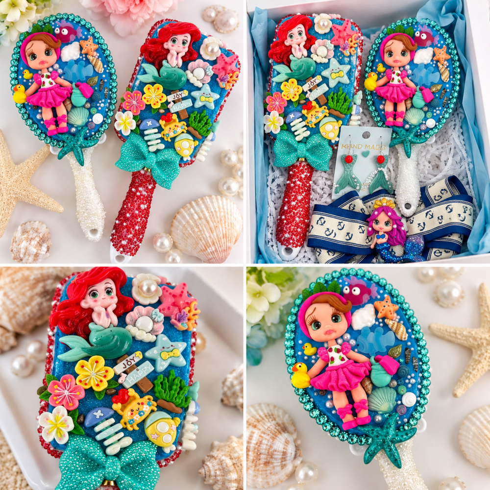 Mermaid-themed gift box with decorated hairbrush, pearl-trimmed hand mirror, mermaid tail earrings, and navy anchor bow with clay doll detail.