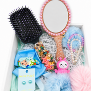 Mermaid gift box with decorated hair brush, pearl mirror, handmade bow, bracelets, and ocean-themed details