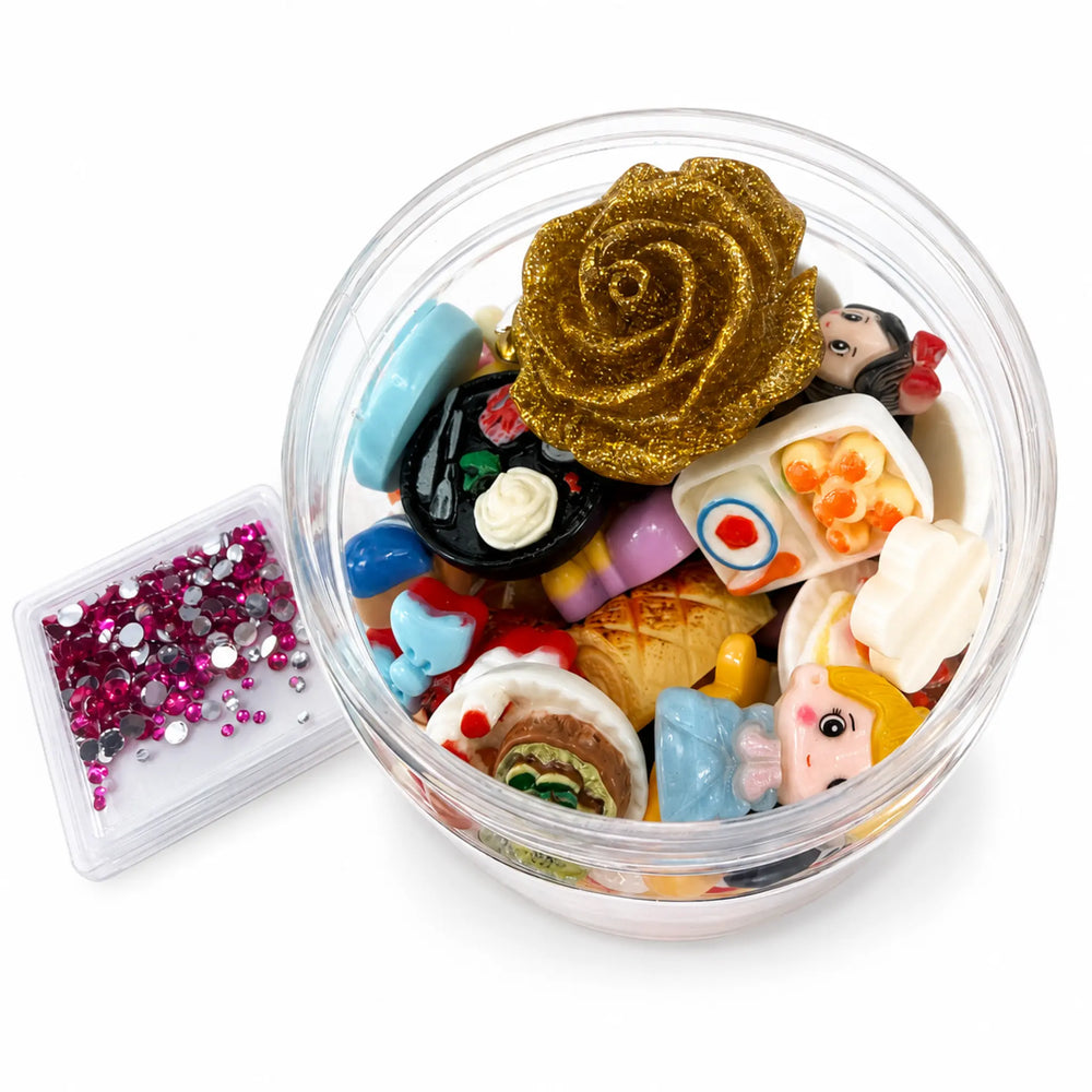 Mixed resin cabochons and kawaii bakery embellishments with gold rose and colorful miniature craft pieces