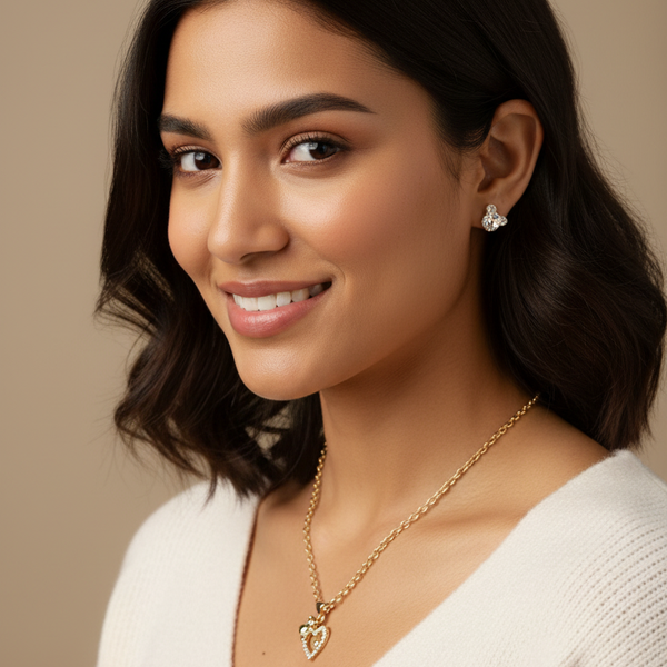 Model wearing a handmade jewelry set featuring a sparkling rhinestone heart pendant necklace and cute crystal teddy bear earrings