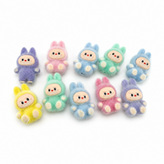 Pastel flocked mini figures in blue, pink, mint, purple and yellow from the available assortment