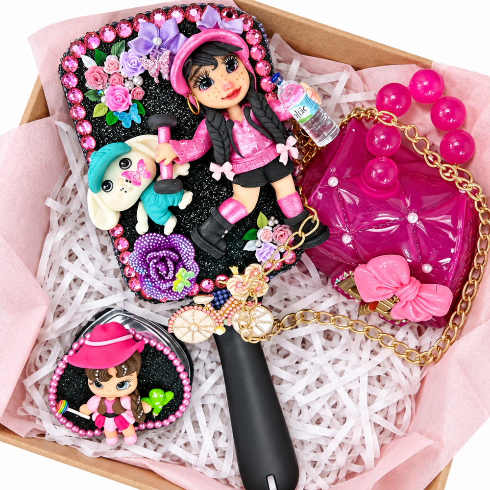 Pink gift box with black hairbrush, purple mini purse, clear mini suitcase, lip gloss, and pink clay cowgirl accent.