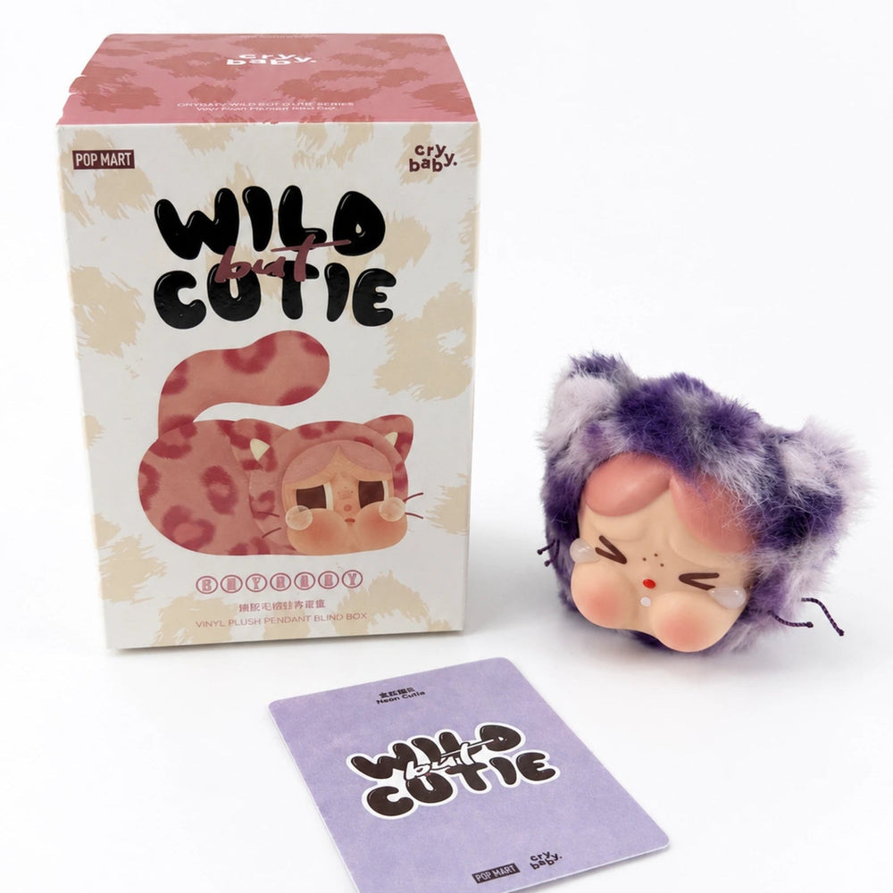 Pop Mart Wild Cutie toy with packaging and card on a white background
