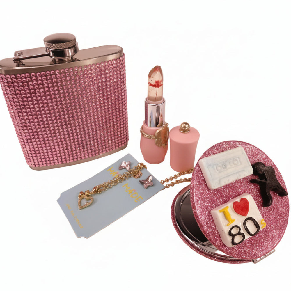 Set of accessories including a steel flask, heart pendant, crystal butterfly earrings, lip gloss, and 80s compact mirror