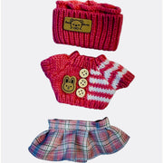 Set of knitted  clothing including a sweater with cute teddy bear in the front, hat, and skirt with strips pink 