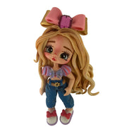 Side view of the lightweight flexible cold porcelain blonde doll flatback centerpiece showing artisan details and hair texture