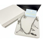 Silver charm anklet for hairdressers featuring detailed scissor and comb pendants