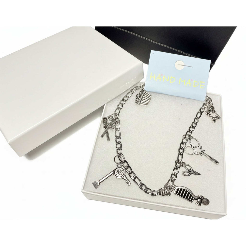 Silver charm anklet for hairdressers featuring detailed scissor and comb pendants