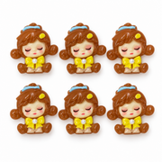 Six brown Sleepy Doll resin flatbacks with yellow bows and blue headbands.
