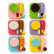 Six colorful 1-inch resin camera flatbacks with glossy raised details, shown as a random-pick craft assortment.