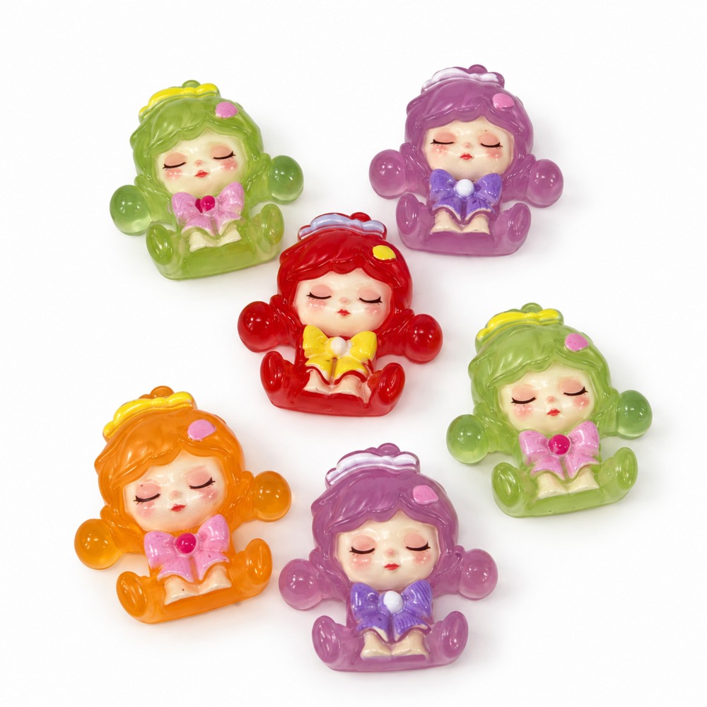 Six colorful sleepy character flatback cabochons in green, purple, red and orange for DIY crafts and decorations.
