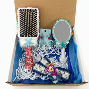 Small decorated mirror with ocean charms and flowers, and mermaid hair bow with clay doll detail