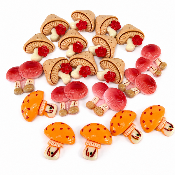 Twenty assorted mushroom resin flatback charms in orange, pink, red, cream, and tan designs.