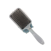 White paddle hair brush with flexible ball-tipped bristles for comfortable detangling and styling