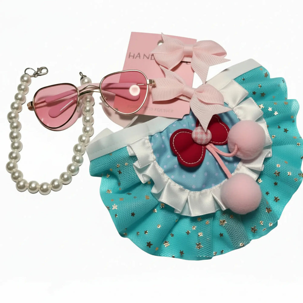 XS dog princess outfit flat lay with blue tutu, pink pearl collar, heart sunglasses and bow accessories