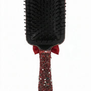 back view of black hair brush from kawaii porcelain doll gift set