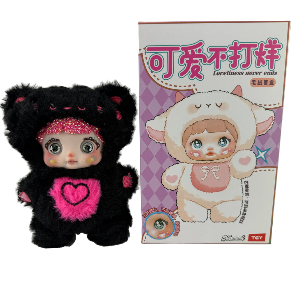 black nommi crystal bedazzled vinyl plush pendant with sparkling pink crystals and color-changing eyes, kawaii collectible