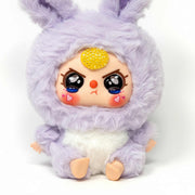 close-up of baby three lilac plush doll with sparkling yellow crystal details