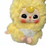 close-up of baby three yellow plush doll with yellow crystal bedazzled