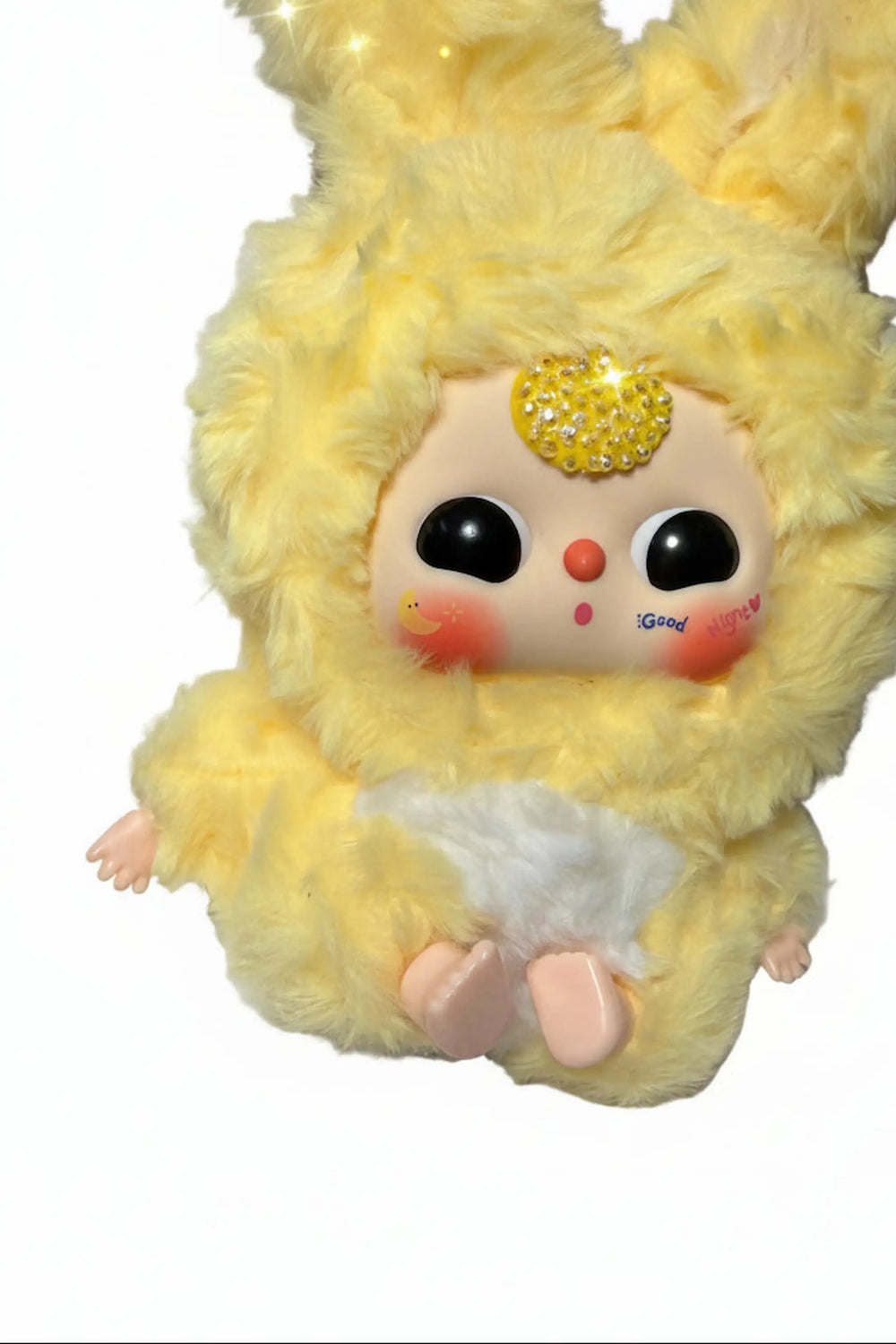 close-up of baby three yellow plush doll with yellow crystal bedazzled
