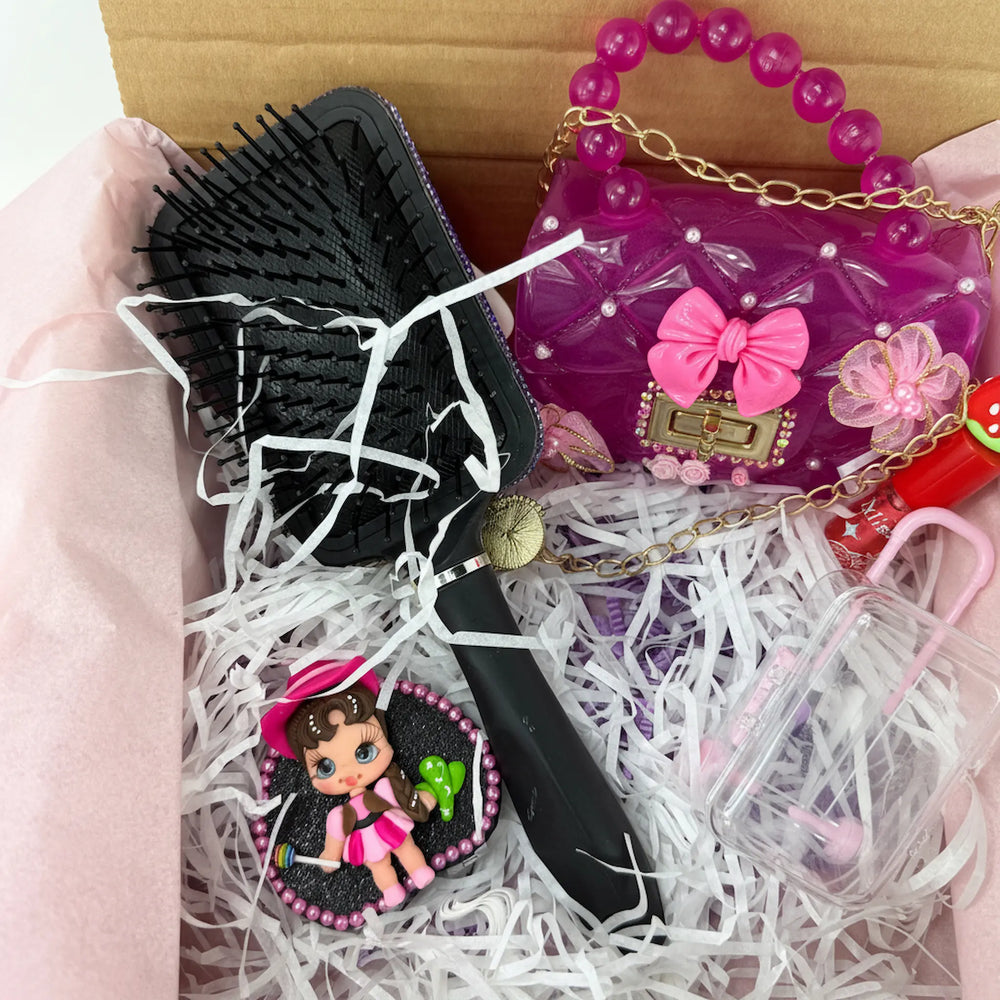close-up of decorated hair brush with flex porcelain bicycle doll, kawaii gift for her