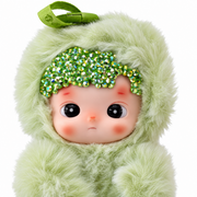 close-up of hacipupu green apple plush showing sparkling crystals, vinyl face and soft green fur