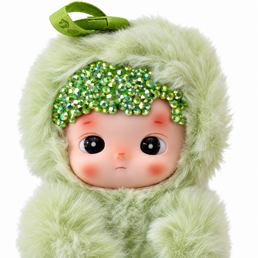 close-up of hacipupu green apple plush showing sparkling crystals, vinyl face and soft green fur
