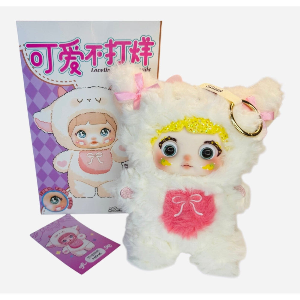 close-up of pink and white nommi mimi plush with color changing eyes