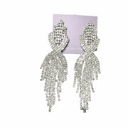 close-up of sparkling silver-tone teardrop earrings 
