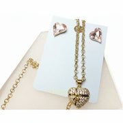 close up of pink crystal heart jewelry set