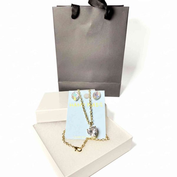 crystal necklace and earring set on a display card with a premium gift bag and white jewelry box.