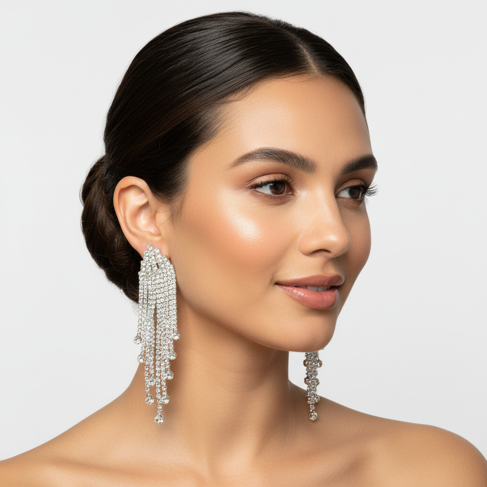 Elegant model showcasing the silver-tone crystal teardrop earrings, demonstrating the cascading sparkle and sophisticated scale of the dangle jewelry for formal events