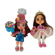 cute cold porcelain flatback girl doll charm wearing a pink pompom beanie and holding a colorful swirl lollipop