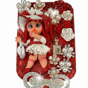 decoden hairbrush close up decorated with porcelain doll face and floral details