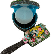 decorated hairbrush next to an open heart shaped jewelry box showing the mirror inside