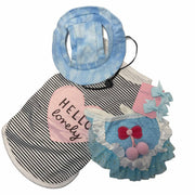 flat lay of dog outfit set with striped shirt tutu sun hat and bows