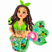 handcrafted mermaid figure with a pink seashell, starfish and decorated green tail