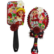 handmade decorated hand mirror with rich red tones strawberry charms flowers and a cute flex porcelain doll