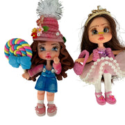handmade flex porcelain dolls set featuring a pink princess with a golden tiara and a girl holding a giant lollipop