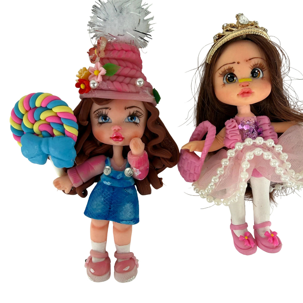 handmade flex porcelain dolls set featuring a pink princess with a golden tiara and a girl holding a giant lollipop