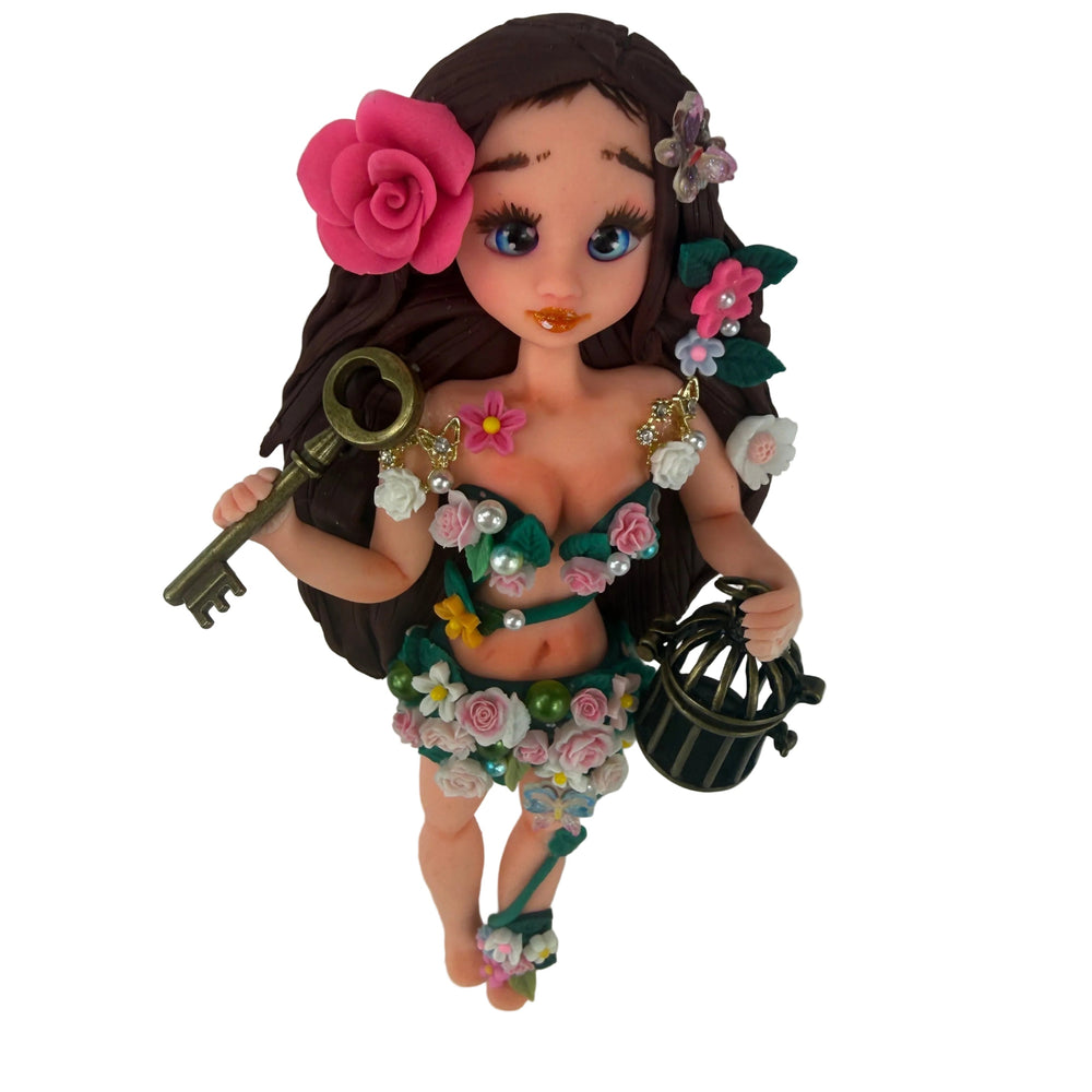 handmade flex porcelain forest fairy doll with pink rose holding a golden key and antique birdcage.
