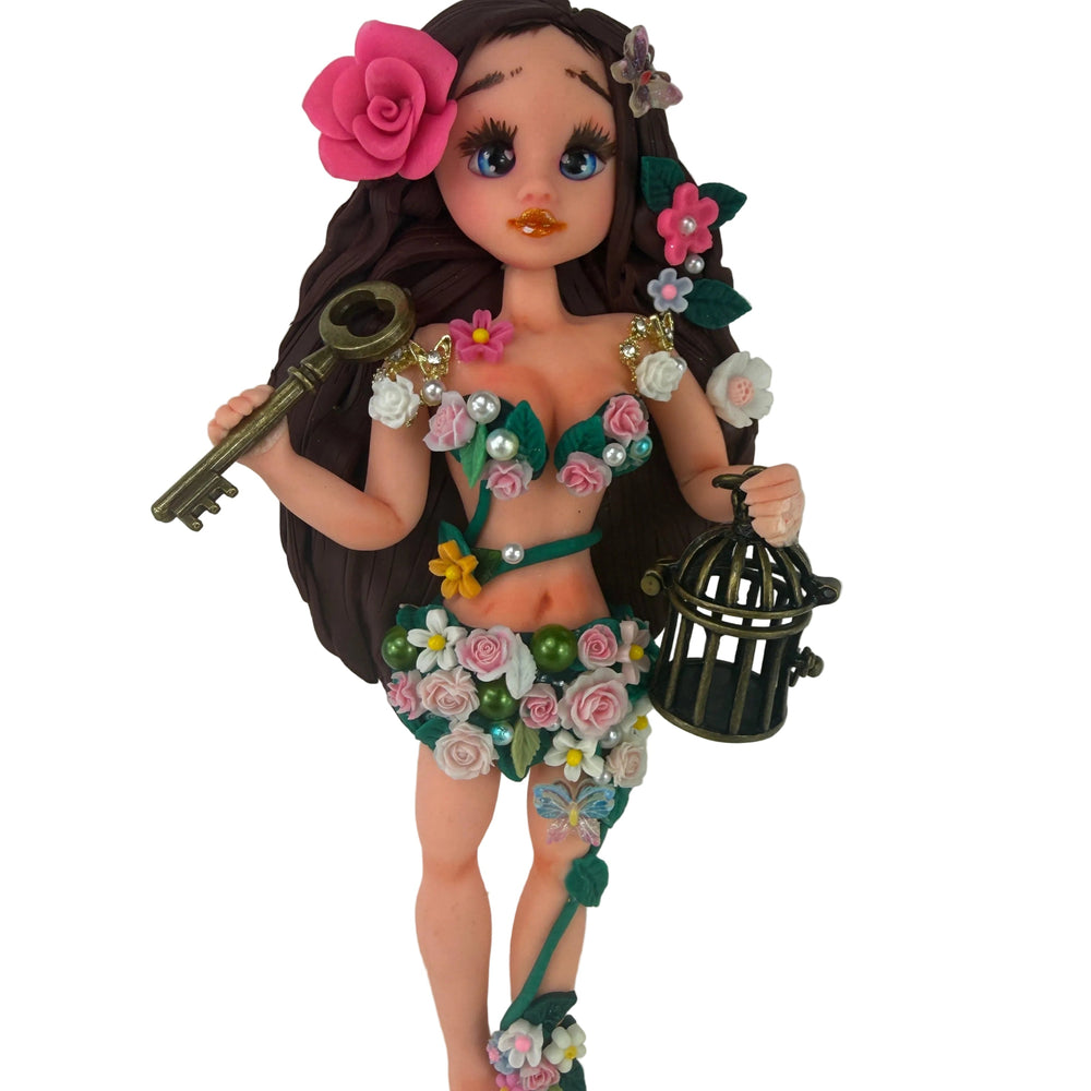 handmade flexible cold porcelain enchanted forest fairy doll with pink rose holding a golden key and birdcage