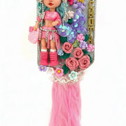 handmade flexible porcelain doll on a pink decorated paddle hair brush