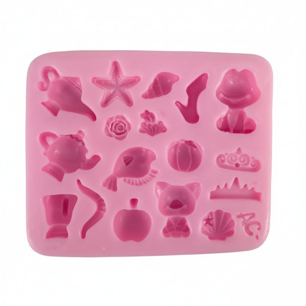 multi-cavity silicone mold for resin and clay casting featuring miniature apple, pumpkin, seashell, and fish shapes