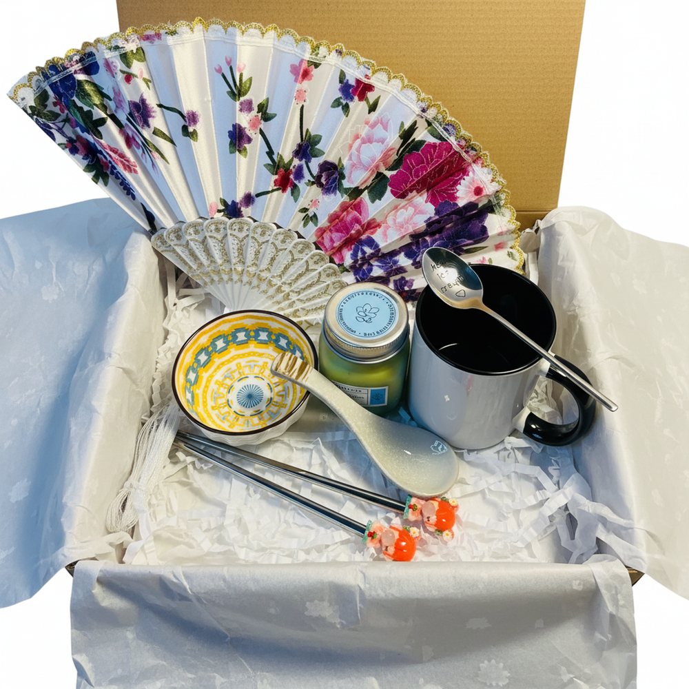 Oriental tea time gift set with ceramic mug, bowl and Asian-inspired accessories
