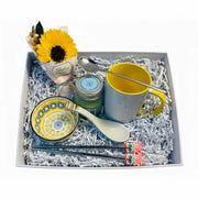 oriental tea set with ceramic mug, metal teaspoon and decorative chopsticks