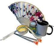 Luxury oriental tea time gift set with ceramic mug, decorative bowl and floral fan
