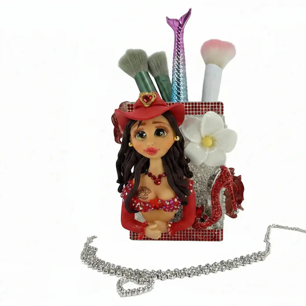 porcelain doll brush holder with cowgirl outfit and glitter charms for vanity