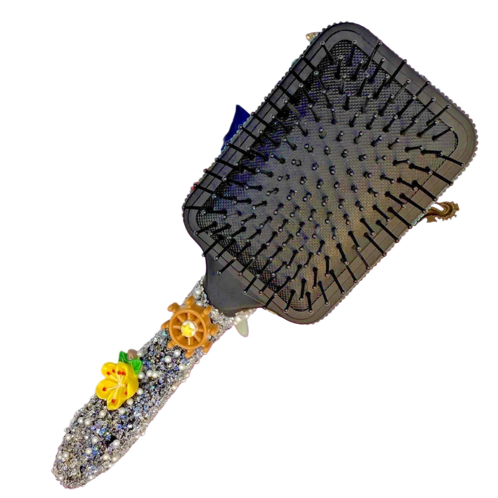 Decorative hairbrush with a gemstone handle 